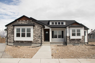 Example of a large transitional white one-story mixed siding house exterior design in Salt Lake City with a shingle roof