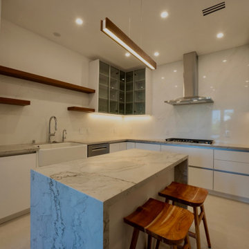 Kitchen With Counter Stools and Open Shelving