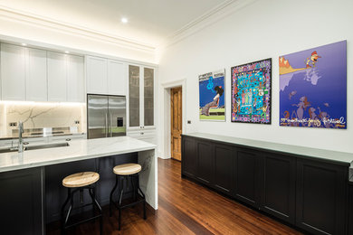 Modern kitchen in Sydney with shaker cabinets, quartz benchtops and stainless steel appliances.