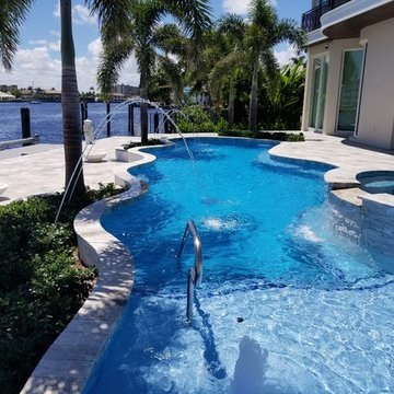Custom Shaped Pool with Sun Shelf, Spa and Laminar Deck Jets in Pompano Beach