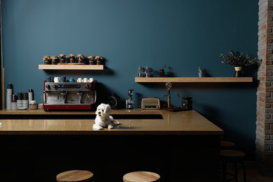 Example of an eclectic kitchen design in Singapore with quartz countertops