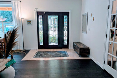 Entryway photo in Seattle with white walls