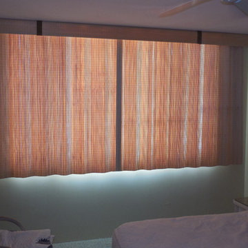 Split draw sliding woven wood treatments over a sliding glass window can be a ni