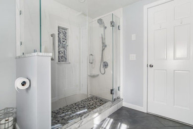 Bathroom photo in Providence with blue cabinets and marble countertops