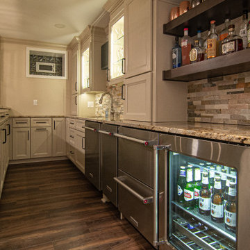 Basement Showing Warm Colors, Straight Lined Cabinets and Stacked Stone