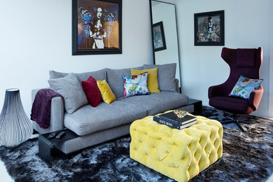 Photo of a small contemporary enclosed living room in Other with white walls, ceramic flooring, a freestanding tv and white floors.