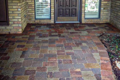 Inspiration for a mid-sized front yard concrete paver patio remodel in Dallas