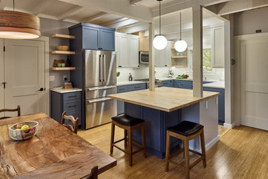 Inspiration for a cork floor, beige floor and exposed beam eat-in kitchen remodel in Other with a single-bowl sink, shaker cabinets, blue cabinets, quartz countertops, gray backsplash, ceramic backsplash, stainless steel appliances, an island and white countertops