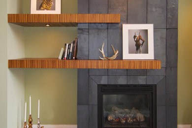 Inspiration for a mid-sized transitional enclosed dark wood floor living room remodel in Toronto with beige walls, a standard fireplace, a stone fireplace and no tv