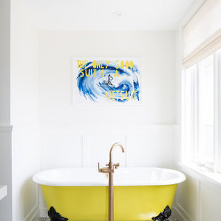 Example of a mid-sized coastal master black and white tile and terra-cotta tile white floor and mosaic tile floor claw-foot bathtub design in Orange County with white walls, open cabinets, a one-piece toilet, an undermount sink, quartz countertops and white countertops