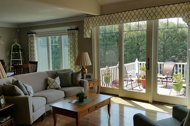 Example of a mid-sized classic light wood floor living room design in Boston with beige walls and a corner fireplace
