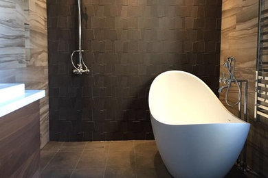Inspiration for a mid-sized contemporary master brown tile and ceramic tile ceramic tile bathroom remodel in San Francisco with flat-panel cabinets, brown cabinets, a one-piece toilet, brown walls, a trough sink and quartzite countertops