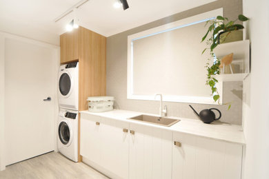 Photo of a contemporary utility room in Hobart.
