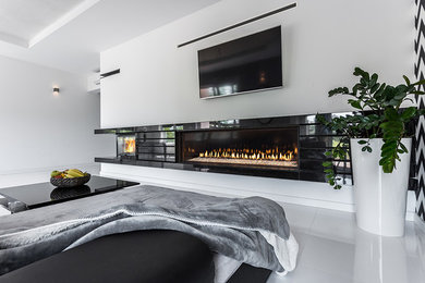 Inspiration for a contemporary bedroom remodel in Vancouver with a standard fireplace