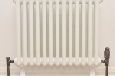 White column radiator with cast iron feet