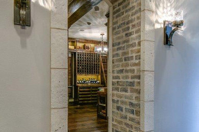 Inspiration for a mid-sized dark wood floor wine cellar remodel in Houston