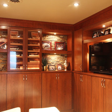 Built in TV Surrounded by Cherry Flat Front Cabinets in Cigar Room