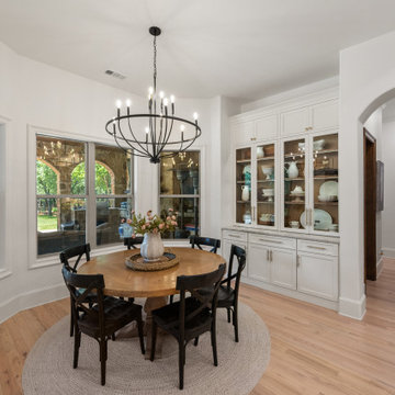 Dining Nook with Custom Glass-Front Inset Hutch and Matte Black Wagon Wheel Chan