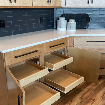 Angled Kitchen Design with Slab Style Cabinets in Pecan Stain