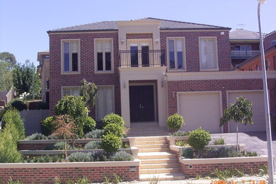 Photo of a traditional home design in Melbourne.