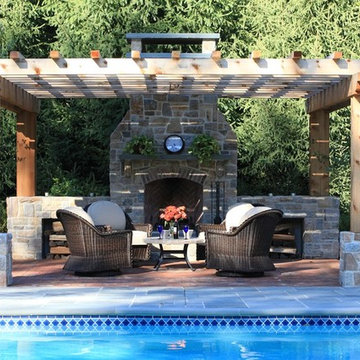 Poolside Fireplace, patio and pergola