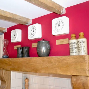 Striking red traditional kitchen in  Georgian cottage