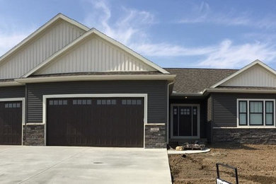 Inspiration for a mid-sized craftsman gray one-story vinyl gable roof remodel in Chicago
