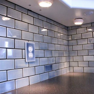 Hand made tile backsplash with custom impressions