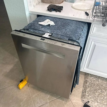 Berne technician servicing a dishwasher