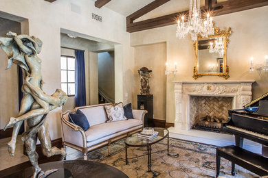 Living room - large traditional enclosed and formal dark wood floor living room idea in Orange County with beige walls, a standard fireplace, a plaster fireplace and no tv