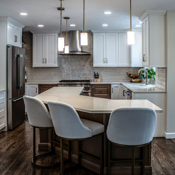 Two Tone Kitchen with Floating Shelves and Island Seating and Updated Fireplace
