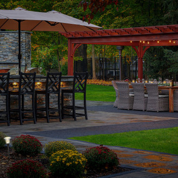 Make a Statement with a Versatile Outdoor Kitchen and Double Fire Feature