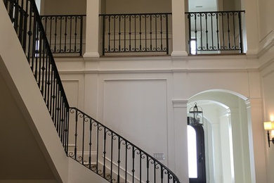 Hallway - large traditional medium tone wood floor and brown floor hallway idea in Toronto with white walls
