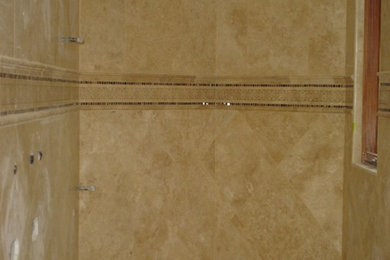 Master beige tile and stone tile bathroom photo in San Diego