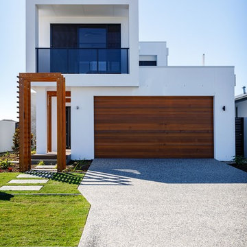 Double Lock Up Garage with timber roller accents the Modern Exterior