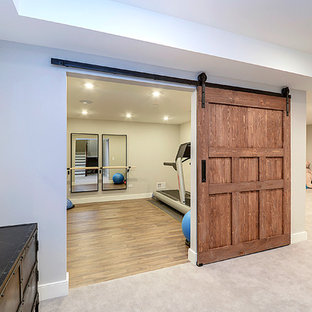 Design ideas for a large classic fully buried basement in Chicago with grey walls and dark hardwood flooring.