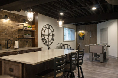 Inspiration for a large industrial look-out vinyl floor and gray floor basement remodel in Chicago with a bar, a corner fireplace and a brick fireplace