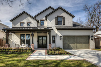 Example of a transitional white two-story exterior home design in Houston