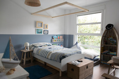 Design ideas for a beach style kids' room in Other.