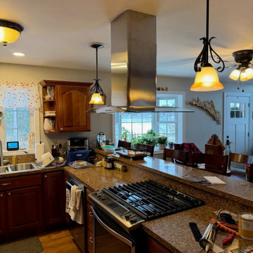 Pendant lighting hung over a kitchen peninsula