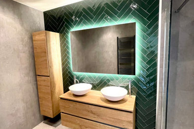 Large elegant ceramic tile alcove shower photo with glass-front cabinets, green cabinets and green walls