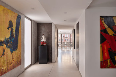 Inspiration for a modern white floor and porcelain tile hallway remodel in Philadelphia with white walls