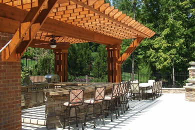 Patio - mid-sized rustic backyard concrete paver patio idea in Nashville with no cover