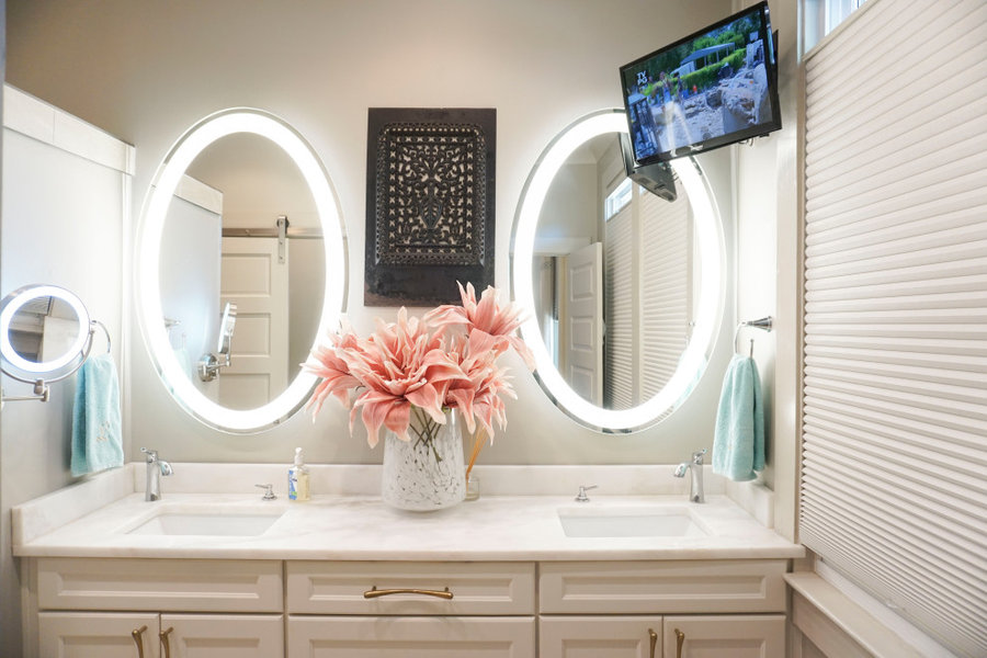 Original fireplace screen used as art in Master bathroom