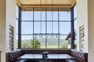 Inspiration for a rustic medium tone wood floor and brown floor dining room remodel in San Francisco with white walls