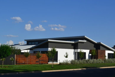 Photo of a contemporary home design in Newcastle - Maitland.