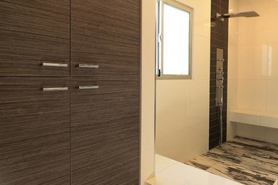 Mid-sized minimalist master white tile and porcelain tile porcelain tile and white floor corner shower photo with flat-panel cabinets, dark wood cabinets and white walls
