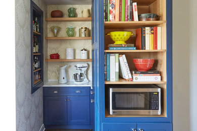Example of a mid-sized arts and crafts l-shaped dark wood floor and brown floor kitchen pantry design in Chicago with a single-bowl sink, shaker cabinets, blue cabinets, marble countertops, gray backsplash, marble backsplash, stainless steel appliances and no island