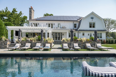 Beach style pool photo in New York