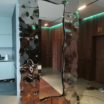 Feature Wall with Floor to Ceiling Mirror Framed in Decorative Glass